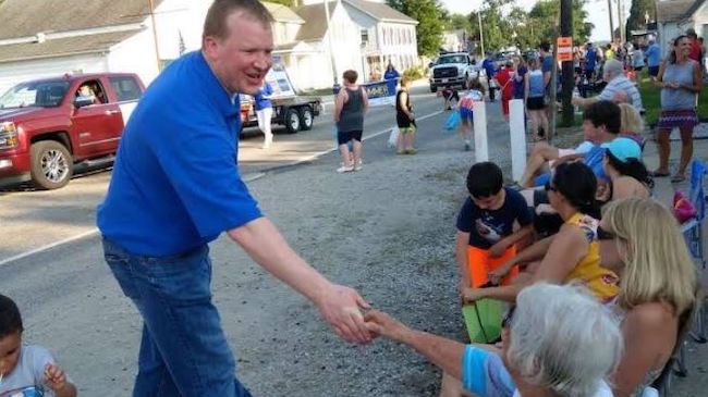 Shaking hands during a parade